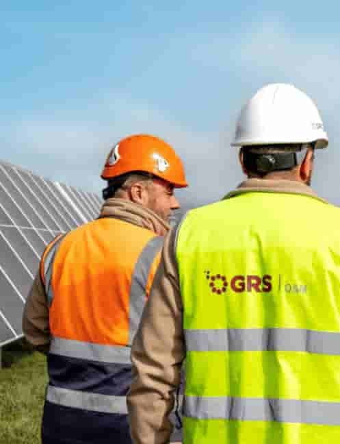 GRS O&M field technicians inspecting a solar array on site