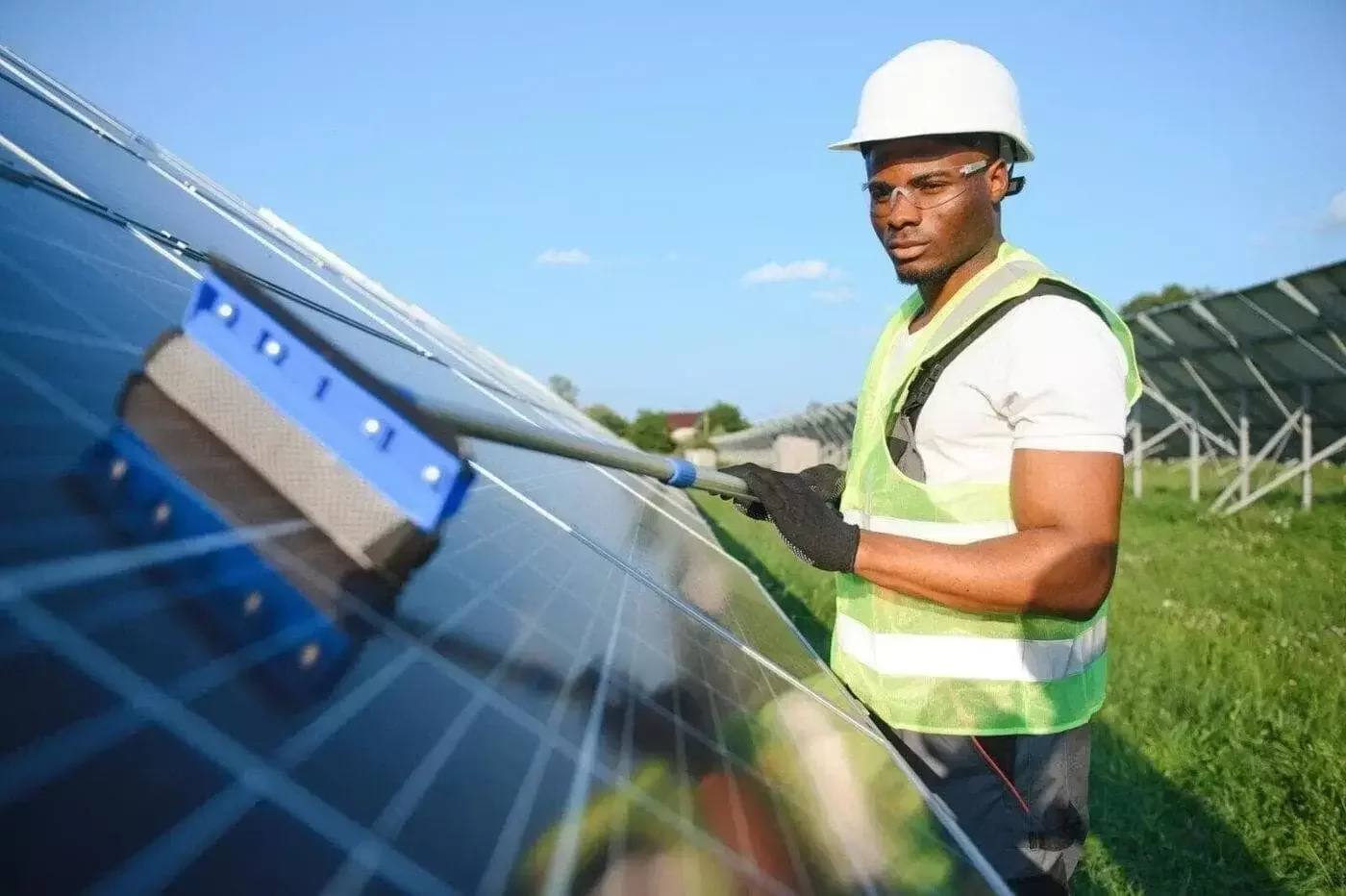 Owner Mindset crew washing solar modules to maintain panel efficiency