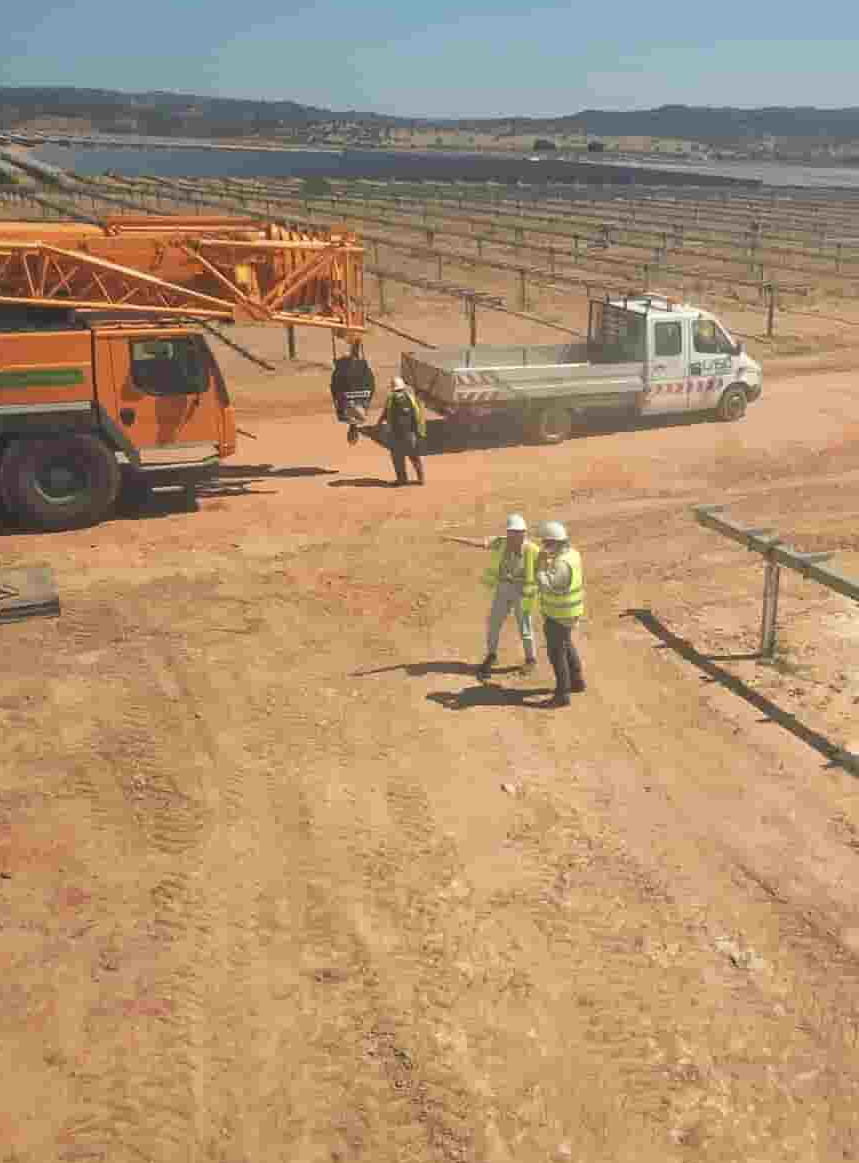 Solar O&M maintenance team with a service vehicle at a solar PV plant