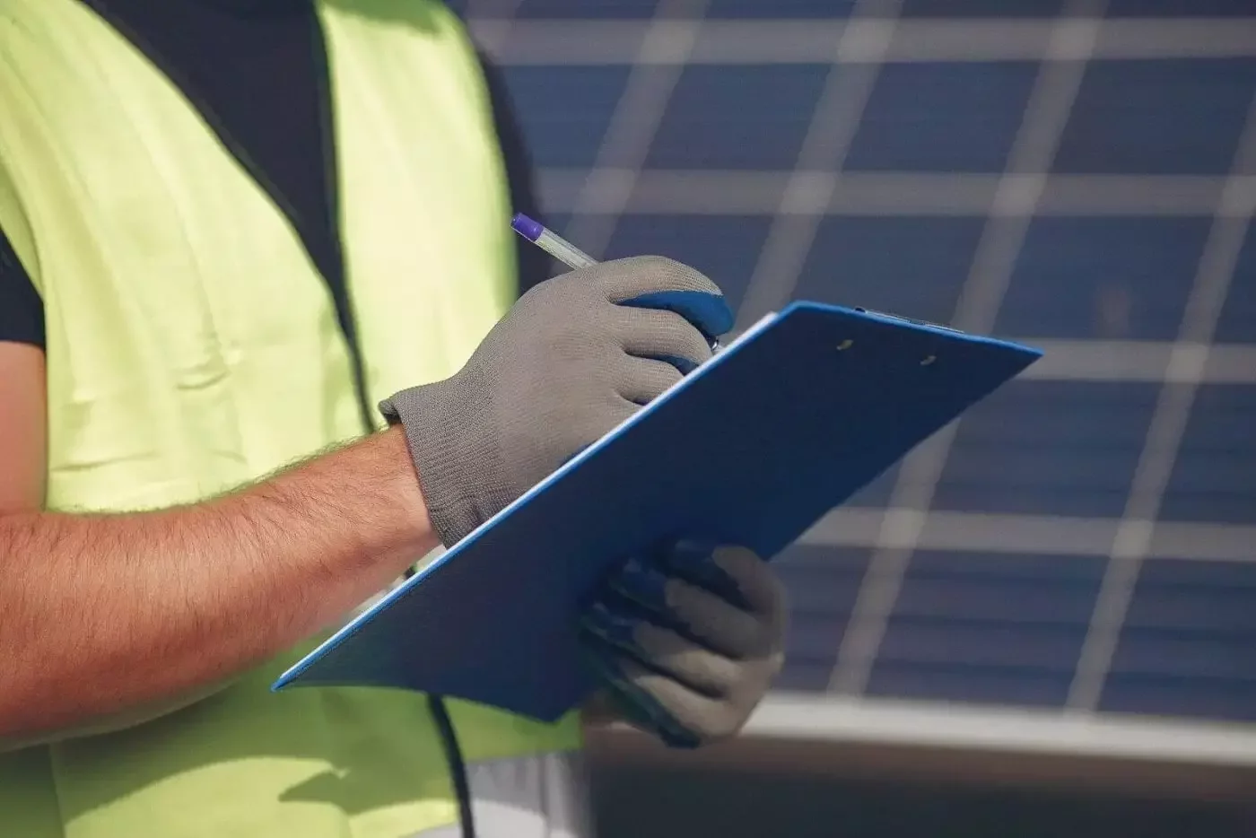 Solar O&M engineer reviewing plant performance data